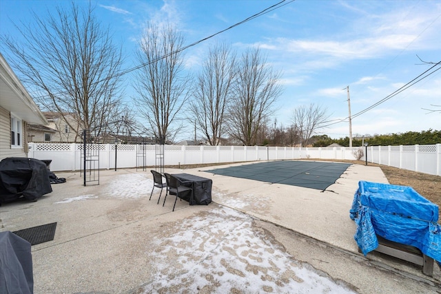 view of swimming pool with a grill and a patio area