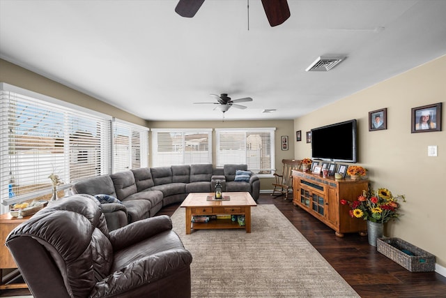 living room with ceiling fan and dark hardwood / wood-style floors