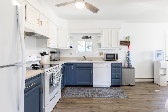 kitchen featuring open shelves, under cabinet range hood, white appliances, blue cabinets, and a sink