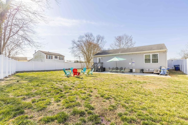 view of yard with a fenced backyard and a patio area