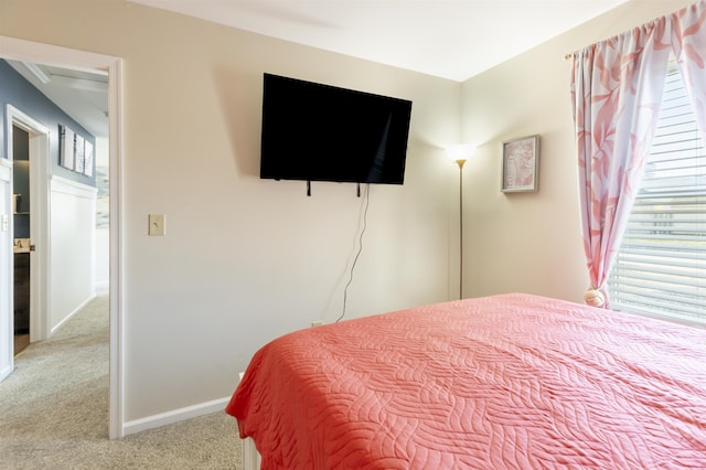 bedroom with baseboards and carpet floors