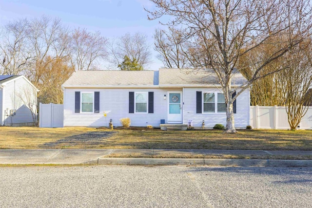 single story home with entry steps, a front lawn, and fence