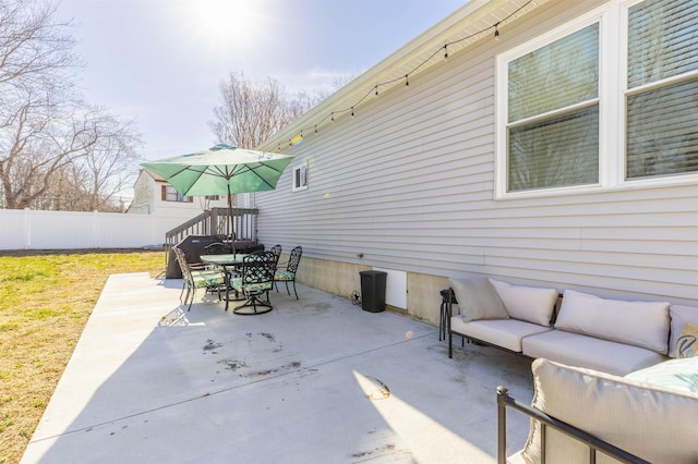 view of patio / terrace with outdoor lounge area, outdoor dining space, and fence