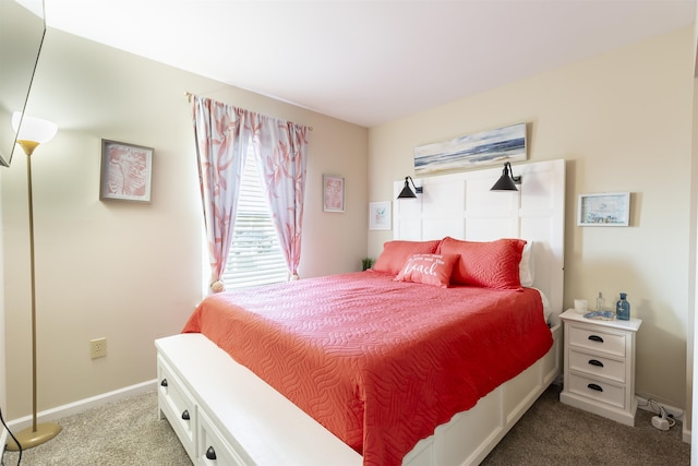 carpeted bedroom with baseboards