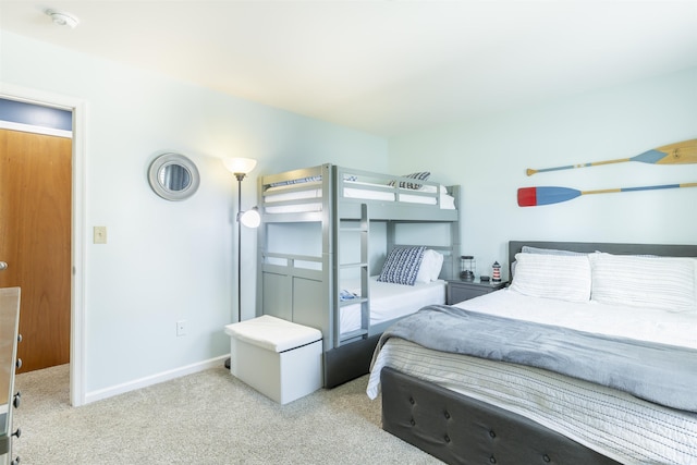 bedroom featuring baseboards and carpet floors