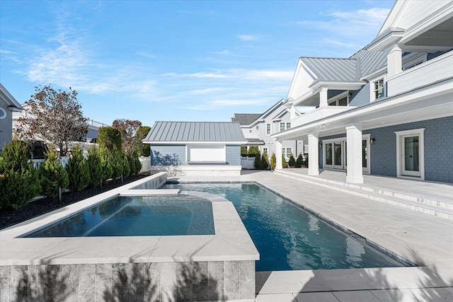 view of pool with an outdoor structure and a patio area