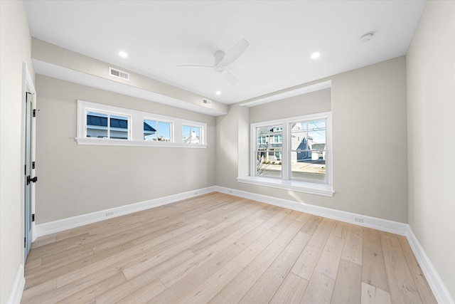 spare room featuring ceiling fan and light wood-type flooring