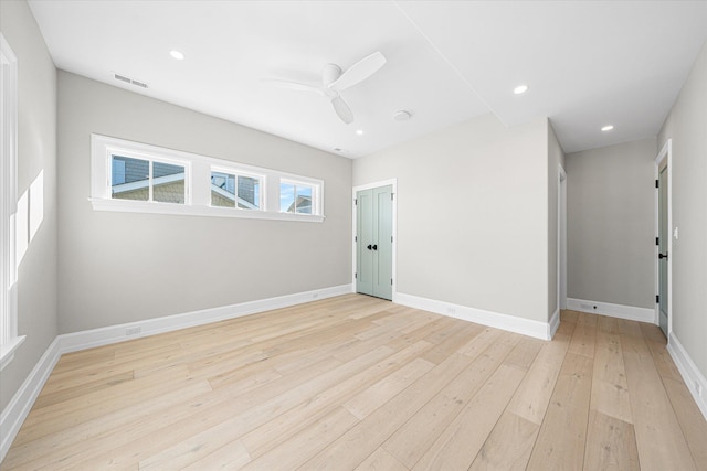 spare room with ceiling fan and light hardwood / wood-style flooring