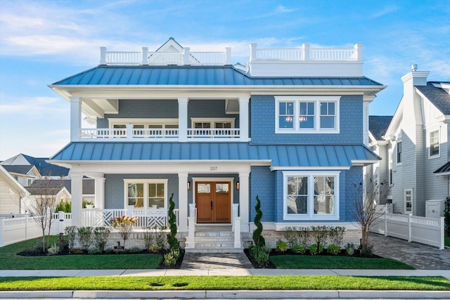 view of front of home featuring a porch and a balcony