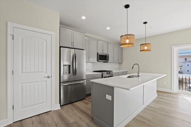 165 E Garfield Ave Unit 110, Wildwood, NJ 08260 - kitchen with stainless steel appliances, gray cabinetry, light wood-style floors, backsplash, and recessed lighting