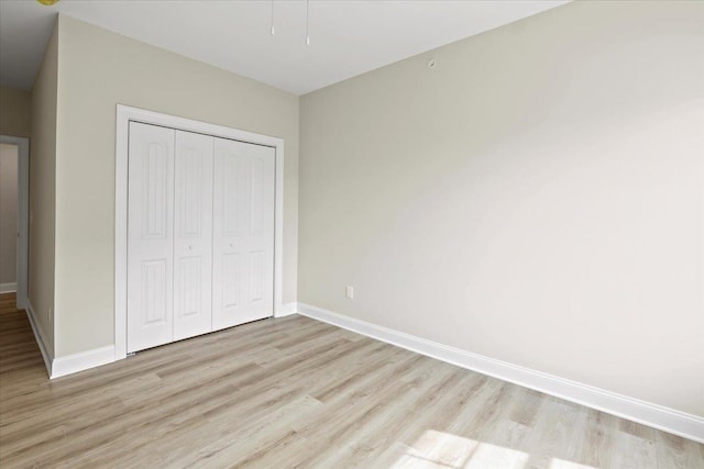 165 E Garfield Ave Unit 110, Wildwood, NJ 08260 - unfurnished bedroom featuring light wood-type flooring and a closet