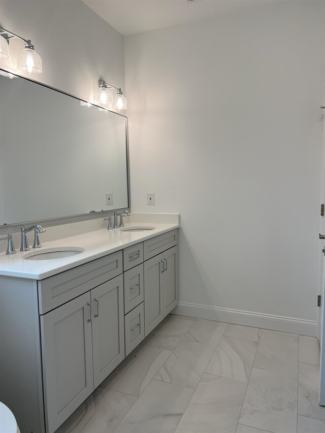 165 E Garfield Ave Unit 110, Wildwood, NJ 08260 - bathroom featuring marble finish flooring and double vanity