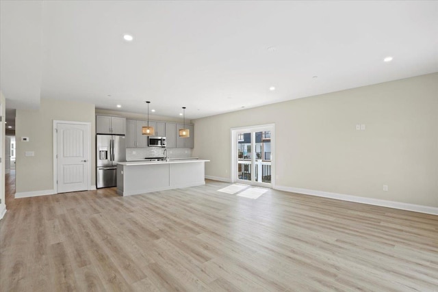 165 E Garfield Ave Unit 110, Wildwood, NJ 08260 - unfurnished living room with recessed lighting and light wood-style floors