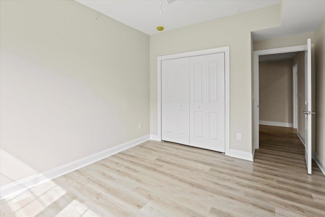 165 E Garfield Ave Unit 110, Wildwood, NJ 08260 - unfurnished bedroom with light wood finished floors and a closet