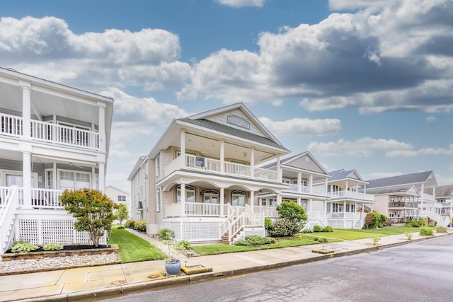 5011 Haven Ave Unit 2, Ocean City, NJ 08226 - view of front of property with a balcony, a porch, stairway, and a residential view