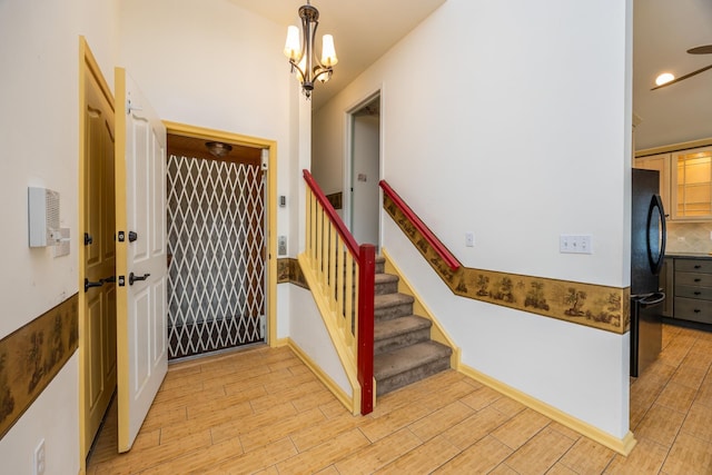 5011 Haven Ave Unit 2, Ocean City, NJ 08226 - entrance foyer with light wood-type flooring, a chandelier, and stairway