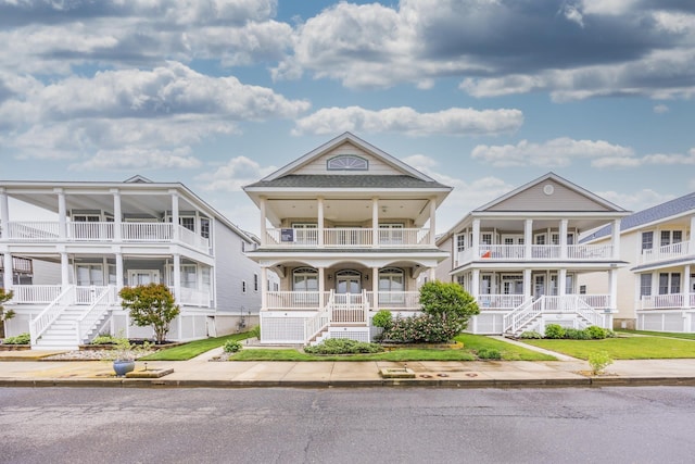 5011 Haven Ave Unit 2, Ocean City, NJ 08226 - view of front facade with stairway, a balcony, and a porch