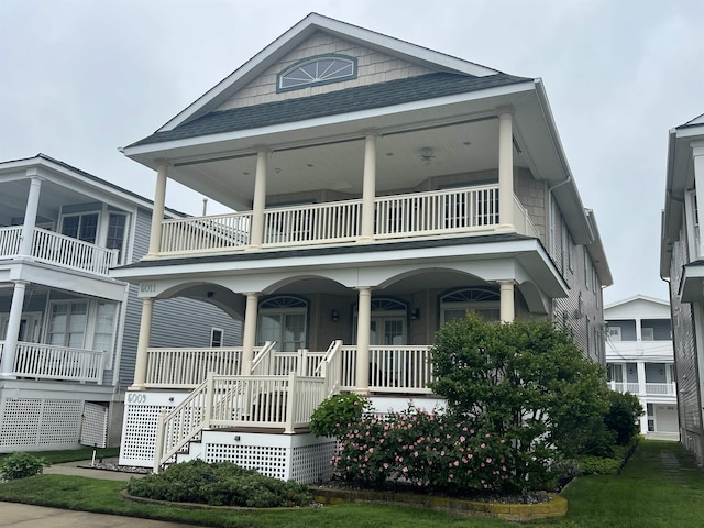 5011 Haven Ave Unit 2, Ocean City, NJ 08226 - view of front facade with a balcony and covered porch