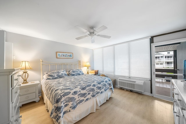 66 E 20th St Unit 108, Avalon, NJ 08202 - bedroom with light wood-style floors, a ceiling fan, and a wall unit AC