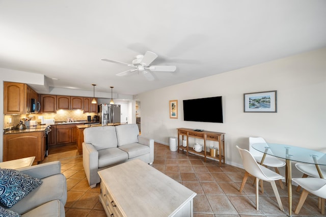 66 E 20th St Unit 108, Avalon, NJ 08202 - living area featuring light tile patterned flooring and a ceiling fan