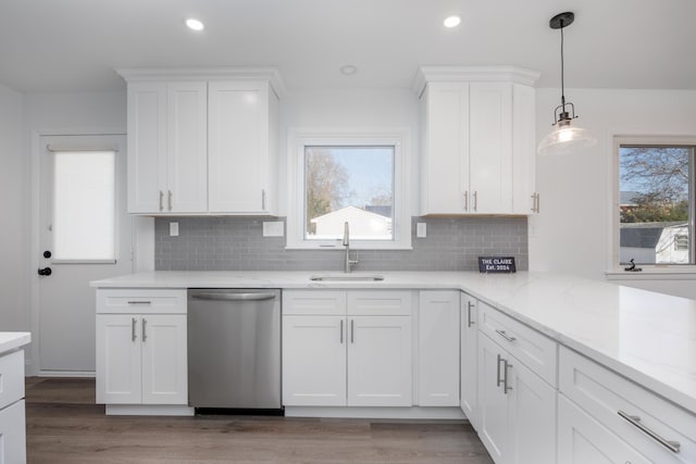 kitchen featuring white cabinetry, sink, and stainless steel dishwasher