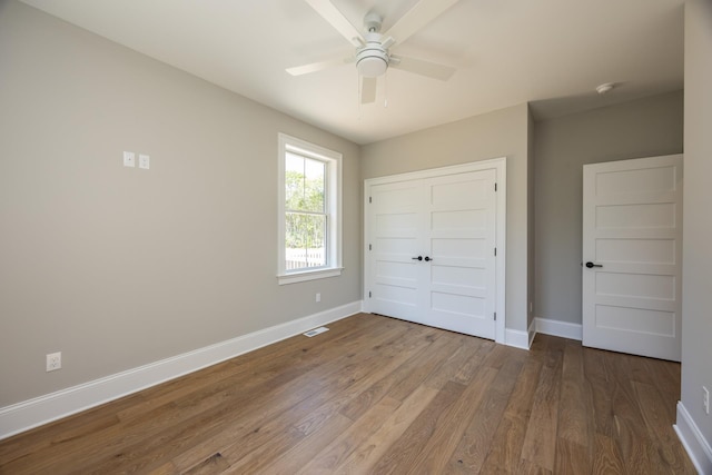 1840 Rt 9th Hwy, Seaville, NJ 08230 - unfurnished bedroom with baseboards, wood finished floors, a closet, and ceiling fan