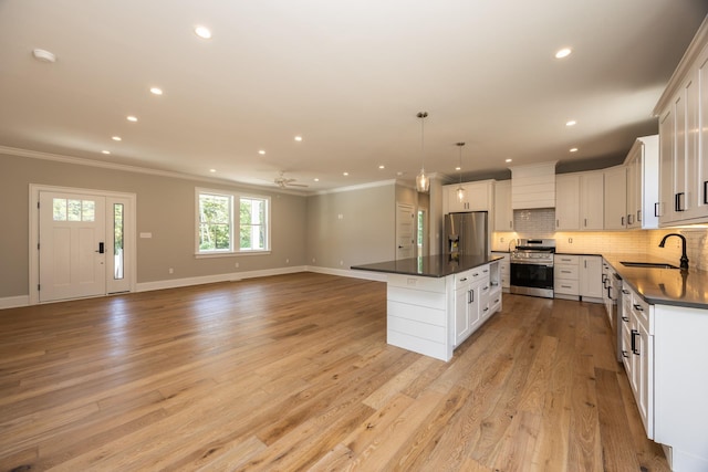 1840 Rt 9th Hwy, Seaville, NJ 08230 - kitchen featuring appliances with stainless steel finishes, a sink, dark countertops, open floor plan, and baseboards