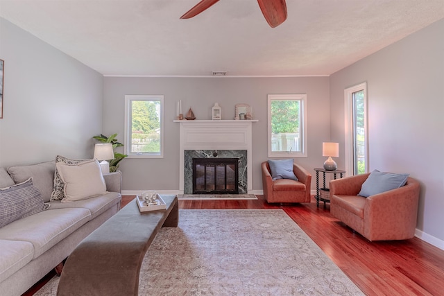 15 Seaview Ave, Beesleys Point, NJ 08223 - living room with wood finished floors, a ceiling fan, plenty of natural light, and a fireplace