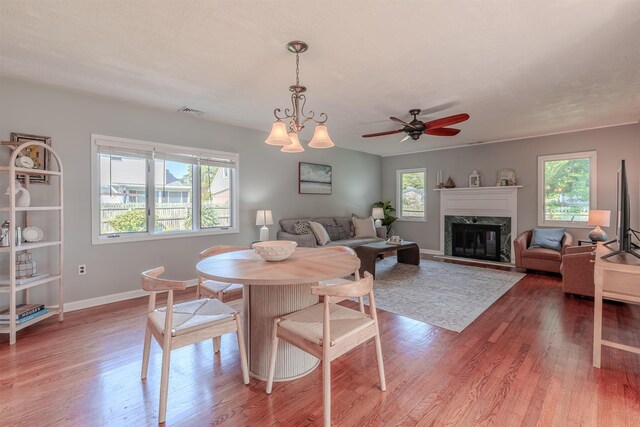 15 Seaview Ave, Beesleys Point, NJ 08223 - dining area featuring wood finished floors, a ceiling fan, and a fireplace