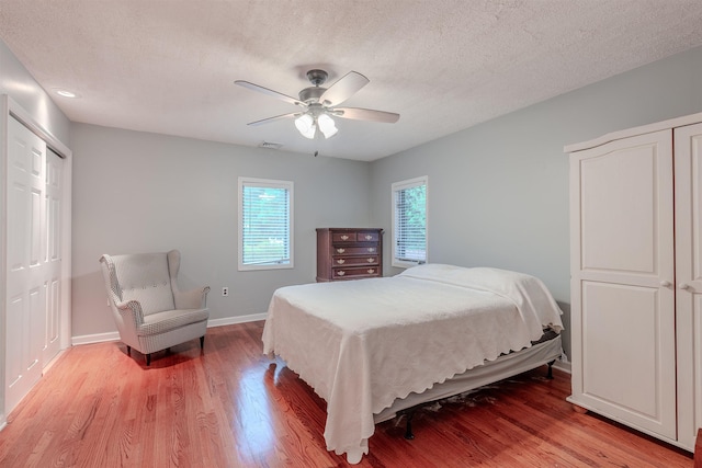 15 Seaview Ave, Beesleys Point, NJ 08223 - bedroom featuring light wood-type flooring, a ceiling fan, and a textured ceiling
