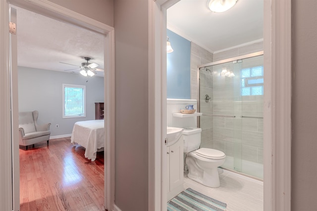 15 Seaview Ave, Beesleys Point, NJ 08223 - ensuite bathroom featuring a shower stall, vanity, ceiling fan, wood finished floors, and ornamental molding