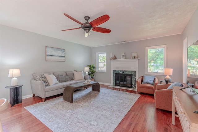 15 Seaview Ave, Beesleys Point, NJ 08223 - living area with a ceiling fan, a high end fireplace, and wood finished floors
