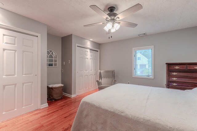 15 Seaview Ave, Beesleys Point, NJ 08223 - bedroom with light wood-type flooring, a closet, ceiling fan, and a textured ceiling