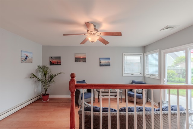 15 Seaview Ave, Beesleys Point, NJ 08223 - bedroom featuring a baseboard radiator, light wood finished floors, ceiling fan, and an office area