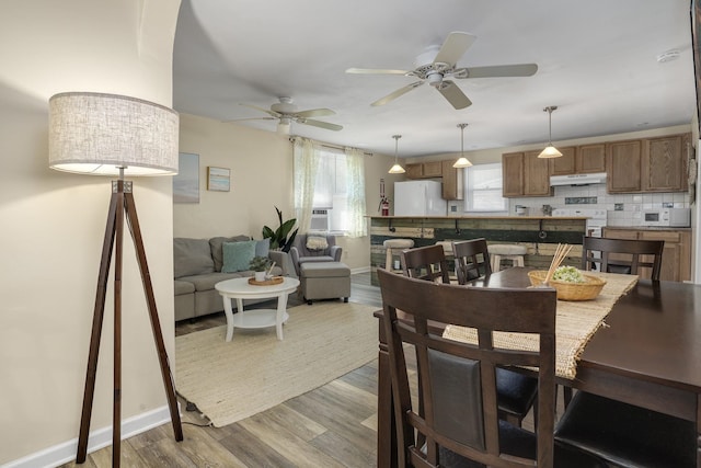 39 E Pacific Ave, Villas, NJ 08251 - dining room featuring wood finished floors, a ceiling fan, and cooling unit