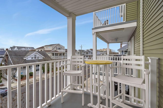 balcony featuring a residential view