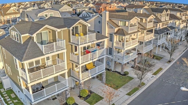 birds eye view of property with a residential view