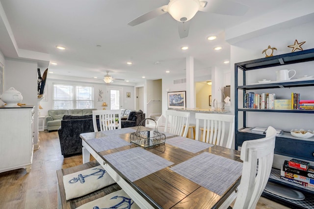 dining area with recessed lighting, visible vents, and light wood-style flooring