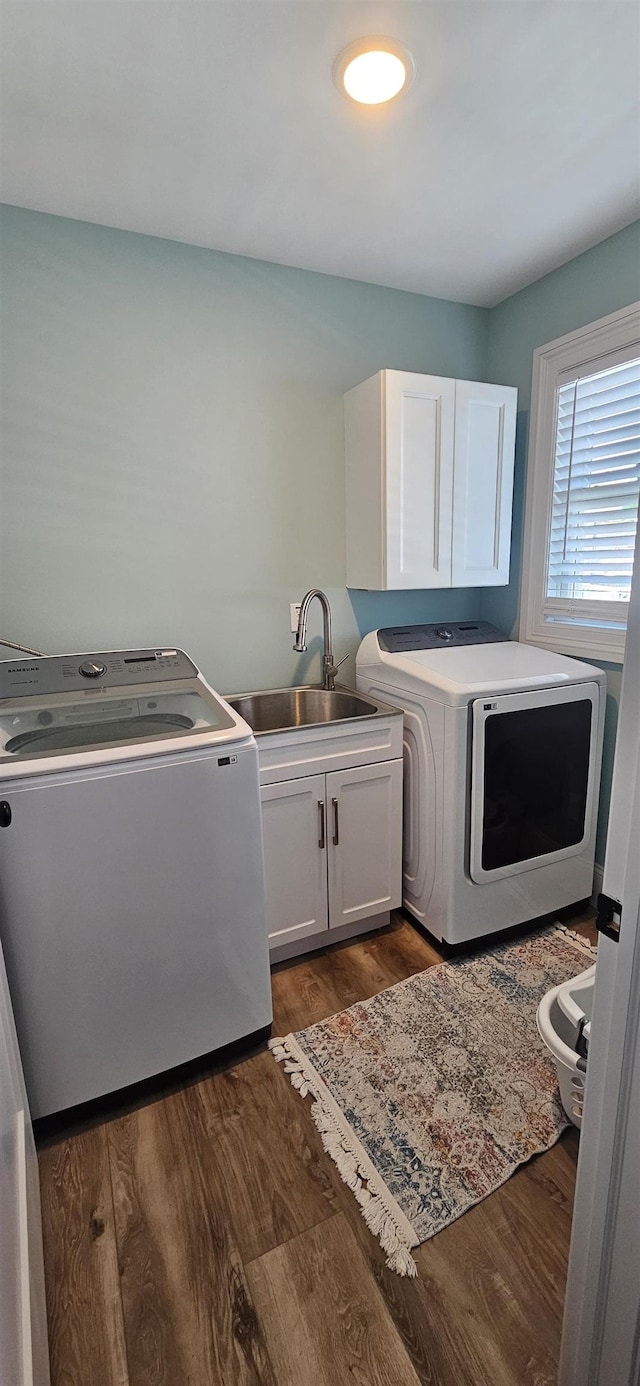 424 W Andrews Ave, Wildwood, NJ 08260 - washroom with separate washer and dryer, cabinet space, and dark wood-style floors