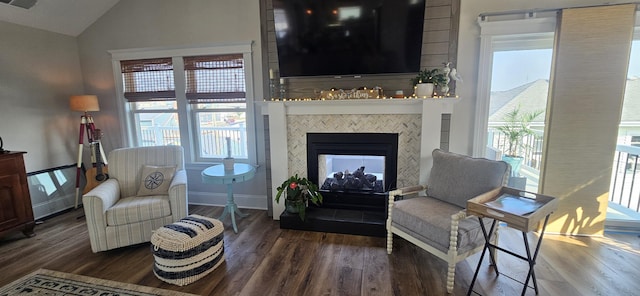 424 W Andrews Ave, Wildwood, NJ 08260 - living area featuring wood finished floors, lofted ceiling, plenty of natural light, and a multi sided fireplace