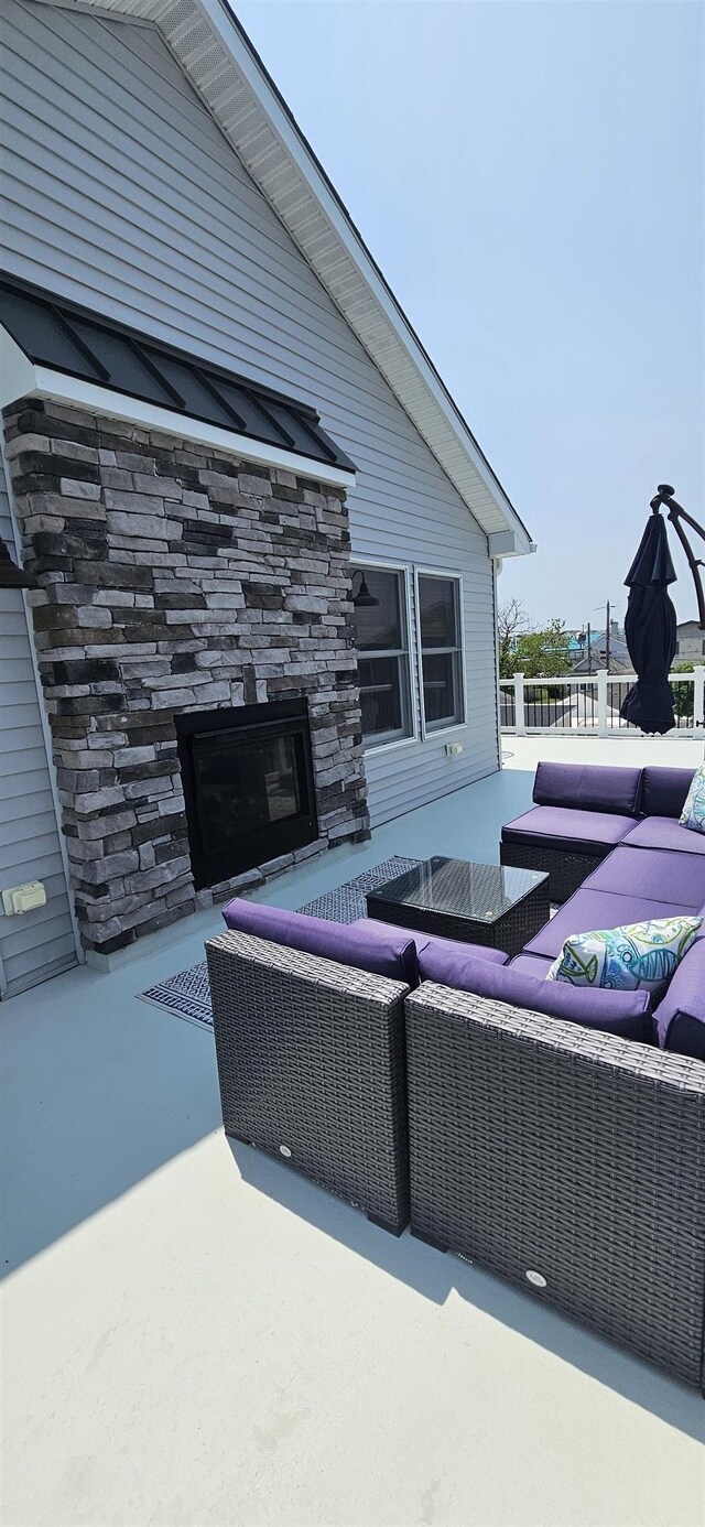 424 W Andrews Ave, Wildwood, NJ 08260 - view of patio / terrace with an outdoor living space with a fireplace