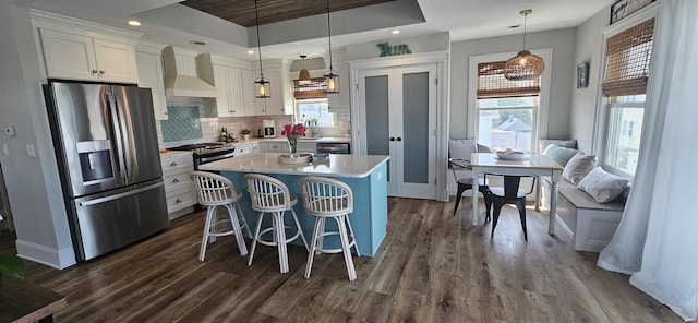 424 W Andrews Ave, Wildwood, NJ 08260 - kitchen featuring stainless steel fridge with ice dispenser, dark wood finished floors, white cabinets, light countertops, and custom range hood