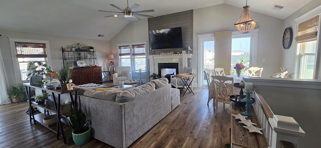 424 W Andrews Ave, Wildwood, NJ 08260 - living room featuring vaulted ceiling, plenty of natural light, dark wood-type flooring, a multi sided fireplace, and ceiling fan