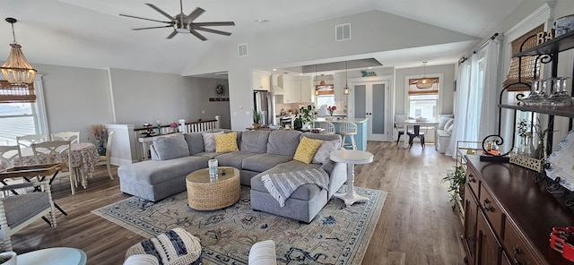 424 W Andrews Ave, Wildwood, NJ 08260 - living area featuring vaulted ceiling, ceiling fan, light wood finished floors, and healthy amount of natural light