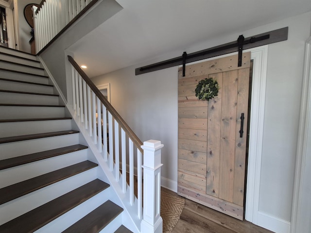 424 W Andrews Ave, Wildwood, NJ 08260 - stairs with wood finished floors, a barn door, and recessed lighting