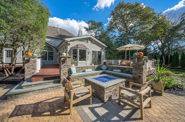 view of patio / terrace with an outdoor fire pit