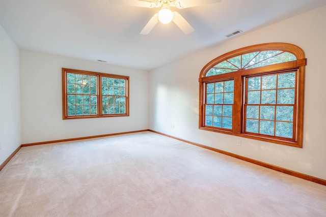 unfurnished room featuring ceiling fan and light colored carpet