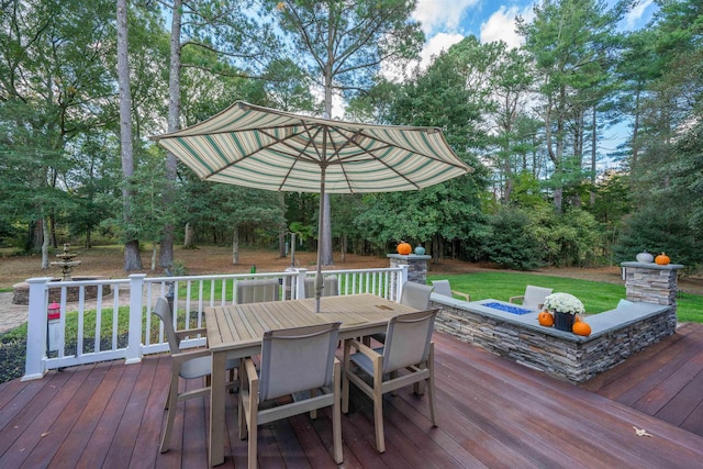 wooden terrace with a yard