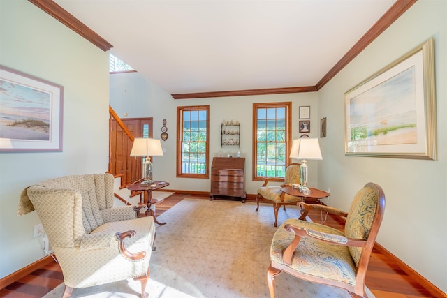 living room with hardwood / wood-style floors and crown molding