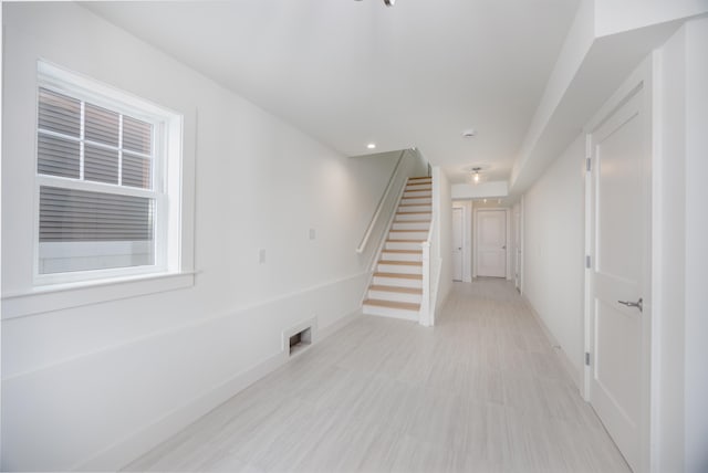 interior space featuring visible vents, stairs, and baseboards